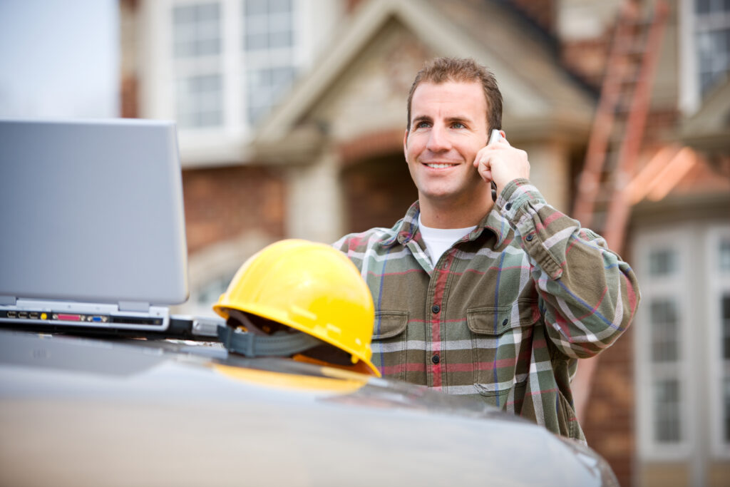 man talking at phone for marketing strategies for contractors