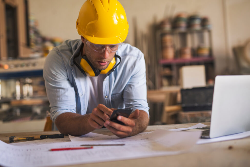 How To Improve SEO For Small Business: 12 Proven Tips 2 Contractor SEO working on mobile optimization